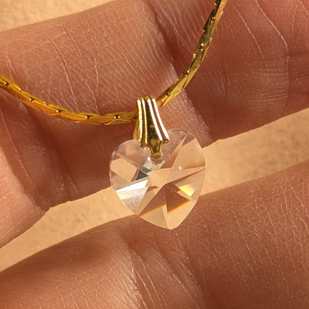Small crystal heart pendant on gold toned chain, friendship